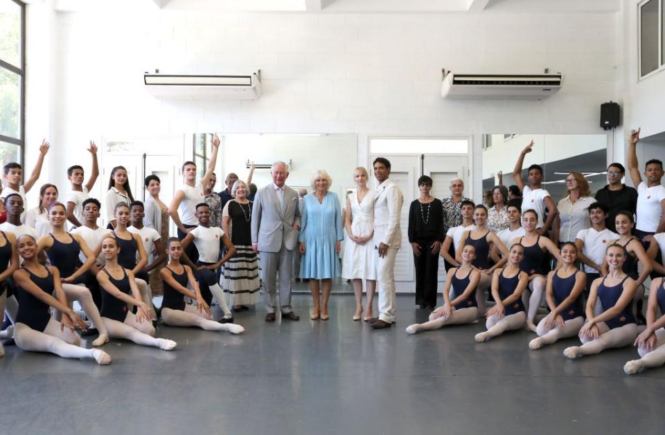 <p>Prince Charles and Camilla pose with ballet dancers during a visit to the Acosta Dance Company during their tour of Havana, Cuba. They are the first British royals to ever make an official visit to the country.</p>