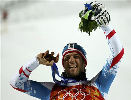 Gold medalist Austria's Mario Matt poses with his medal during the medal ceremony after the men's alpine skiing slalom event during the 2014 Sochi Winter Olympics at the Rosa Khutor Alpine Center February 22, 2014. REUTERS/Leonhard Foeger