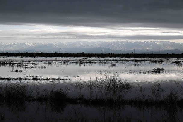 PHOTO: Flooding is shown on farm land in the Central Valley as the Sierra Nevada mountain range stands on the horizon in Tulare County near Allensworth, Calif., on March 22, 2023. (Patrick T. Fallon/AFP via Getty Images)