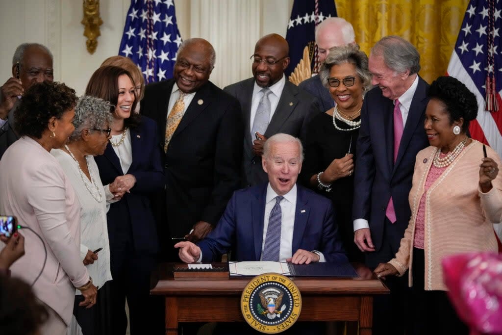 U.S. President Joe Biden signs the Juneteenth National Independence Day Act into law in the East Room of the White House on June 17, 2021 in Washington, DC. The Juneteenth holiday marks the end of slavery in the United States and the Juneteenth National Independence Day will become the 12th legal federal holiday — the first new one since Martin Luther King Jr. Day was signed into law in 1983. (Photo by Drew Angerer/Getty Images)