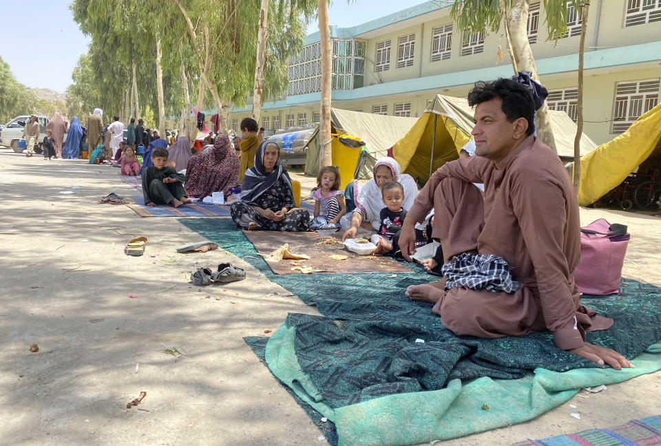 Internally displaced Afghans who fled their home due to fighting between the Taliban and Afghan security personnel, are seen at a camp in Daman district of Kandahar province south of Kabul, Afghanistan, Thursday, Aug. 5, 2021. (AP Photo/Sidiqullah Khan)