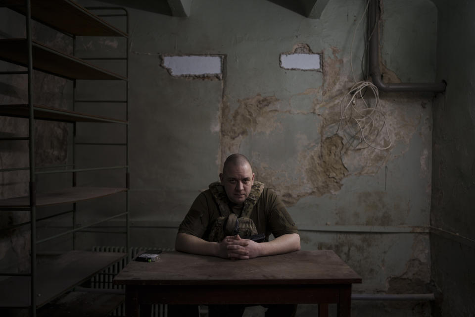 Roman Dudin, head of the Ukrainian Security Service in Kharkiv, poses for a photo inside a basement in Kharkiv, Ukraine, Wednesday, April 13, 2022. Ukrainian authorities are cracking down on anyone suspected of aiding Russian troops under laws enacted by Ukraine’s parliament and signed by President Volodymyr Zelenskyy after the Feb. 24 invasion. Offenders face up to 15 years in prison for acts of collaborating with the invaders or showing public support for them. (AP Photo/Felipe Dana)