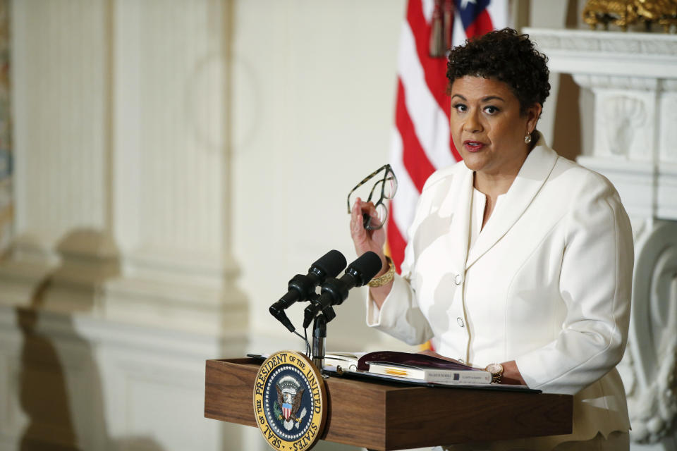 FILE - In this April 17, 2015 file photo, poet laureate Elizabeth Alexander gives a poetry reading in the State Dining Room of the White House in Washington. On Thursday, July 25, 2019, Darren Walker as president of the Ford Foundation and Alexander, president of the Andrew W. Mellon Foundation, shepherded a $30 million deal to buy the photo archive of Ebony and Jet, America's most iconic black magazines. (AP Photo/Andrew Harnik, File)