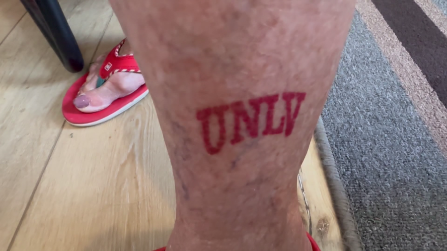 Janet Hopper shows off her UNLV tattoo, which she got at the age of 81. (KLAS)