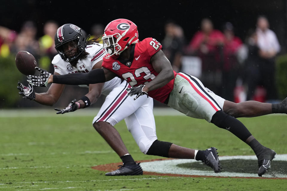 Georgia defensive back Tykee Smith (23) breaks up a pass intended for South Carolina tight end Trey Knox (1) during the first half of an NCAA college football game Saturday, Sept. 16, 2023, Ga. (AP Photo/John Bazemore)