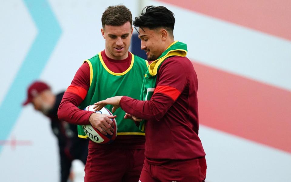 England's George Ford speaks to Marcus Smith during a training session at Pennyhill Park