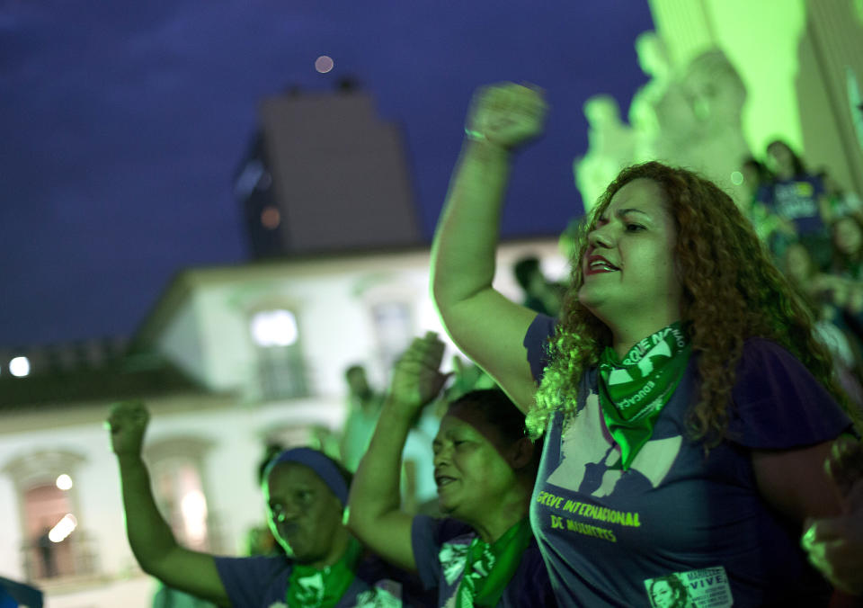 In this June 22, 2018 photo, women take part in a protest demanding the legalization of abortion, in Rio de Janeiro, Brazil. Supporters and opponents of legalizing abortion testified Friday, August 3, in front of Brazil's top court, which is holding two days of extraordinary hearings on an issue increasingly debated in South America. (AP Photo/Silvia Izquierdo)