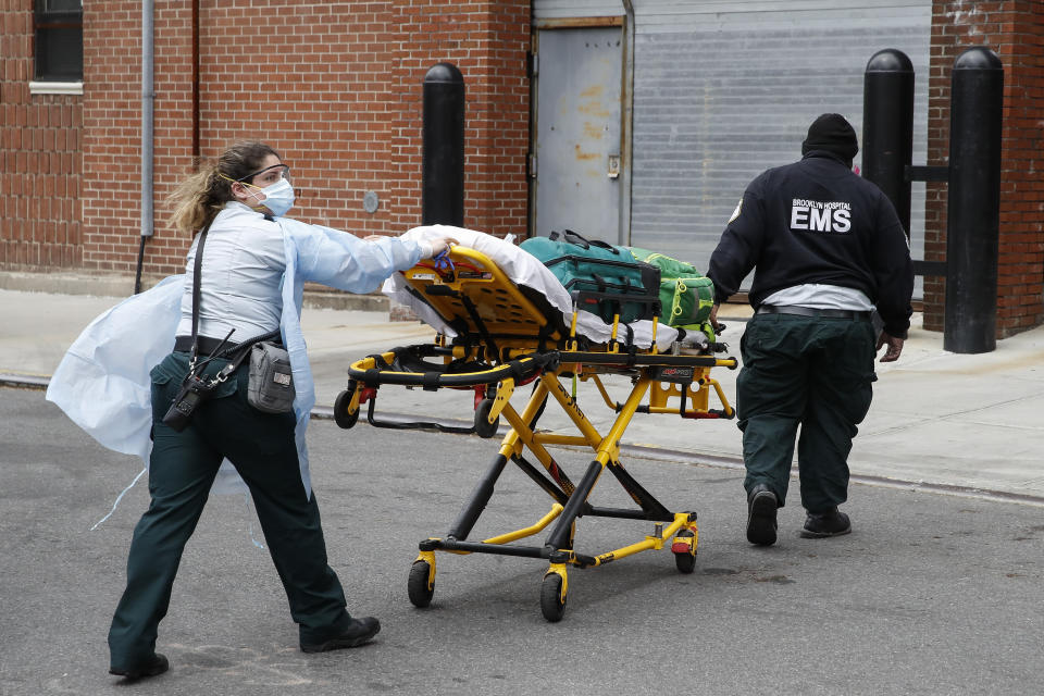 Emergency medical workers arrive at Cobble Hill Health Center on an emergency call, Friday, April 17, 2020, in the Brooklyn borough of New York. The despair wrought on nursing homes by the coronavirus was laid bare Friday in a state survey identifying numerous New York facilities where multiple patients have died. (AP Photo/John Minchillo)