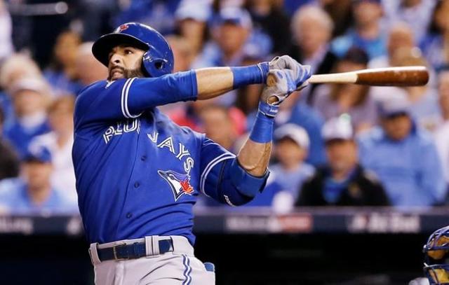 New York Mets' Jose Bautista, right, visits with Little League