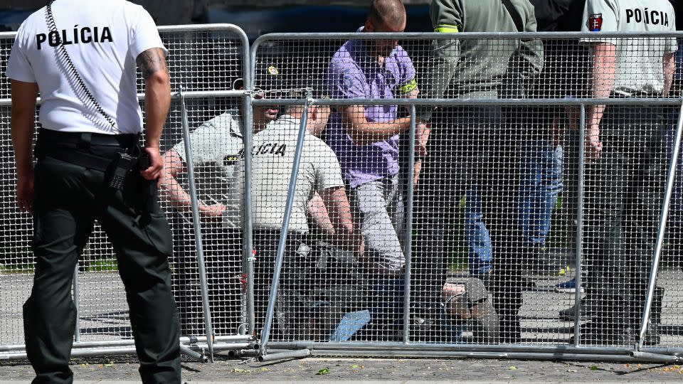 Security personnel apprehend a suspected gunman after Slovakia's Prime Minister was shot in Handlova, Slovakia on May 15, 2024. - AFP/Getty Images