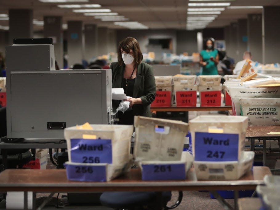 Claire Woodall-Vogg, executive director of the Milwaukee election commission collects the count from absentee ballots from a voting machine on November 04, 2020 in Milwaukee, Wisconsin.