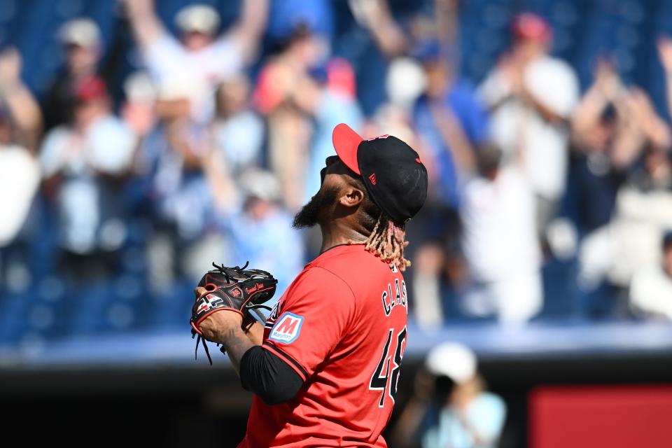 Cleveland Guardians relief pitcher Emmanuel Clase (48) celebrates after the Guardians beat the Kansas City Royals on Wednesday in Cleveland.