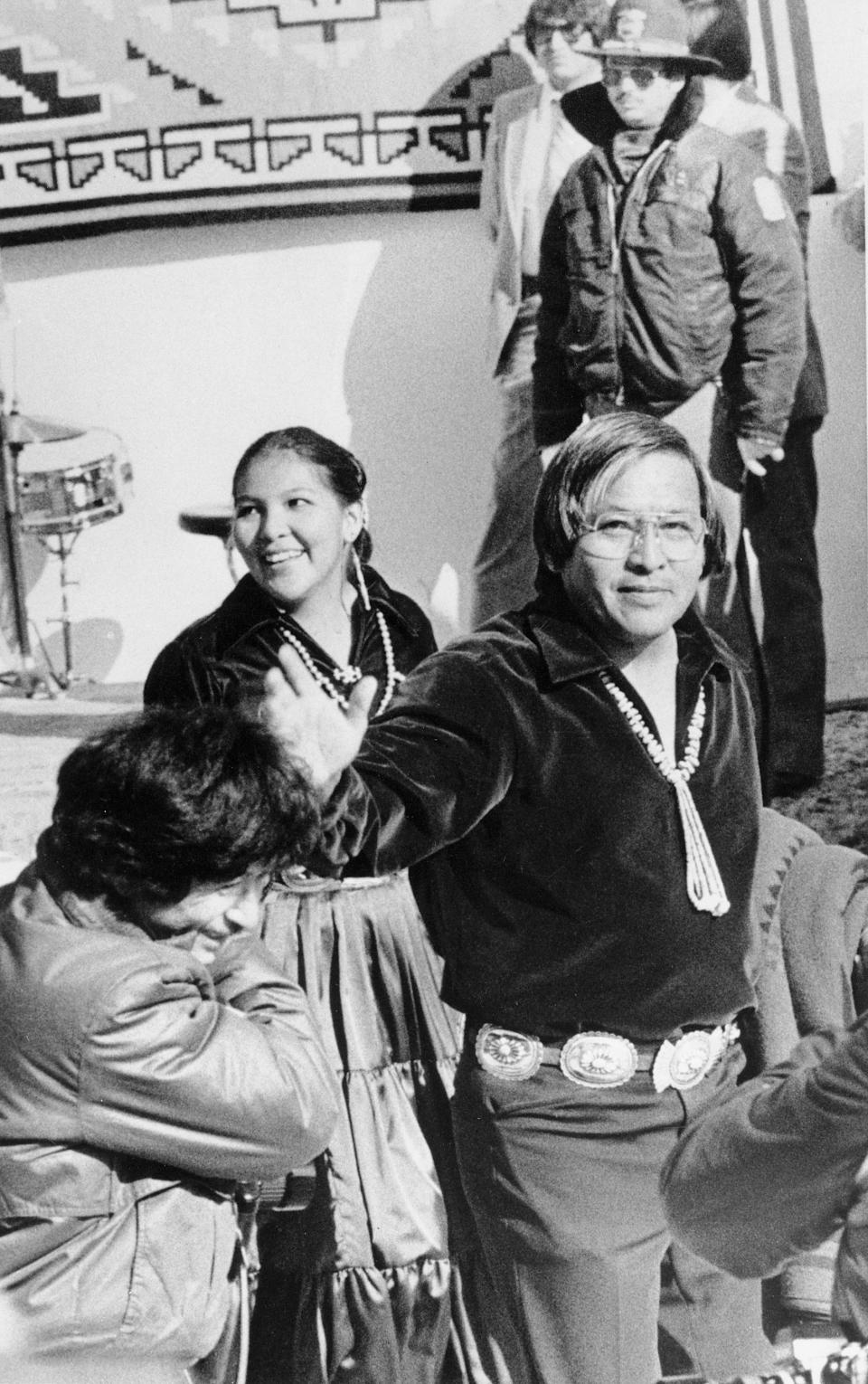 FILE - Peterson Zah waves to supporters as he arrives at the Navajo Nation tribal fairgrounds in Window Rock, Az. on Jan. 11, 1983. Zah, a monumental Navajo Nation leader who guided the tribe through a politically tumultuous era and worked tirelessly to correct wrongdoings against Native Americans, has died. He died late Tuesday, March 7, 2023, at a hospital in Fort Defiance, Arizona, after a lengthy illness, Navajo President Buu Nygren's office said. He was 85. (AP Photo, File)