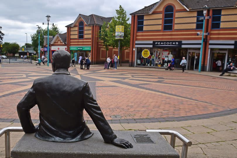 Huyton Village shopping area. Lord Harold Wilson statue.