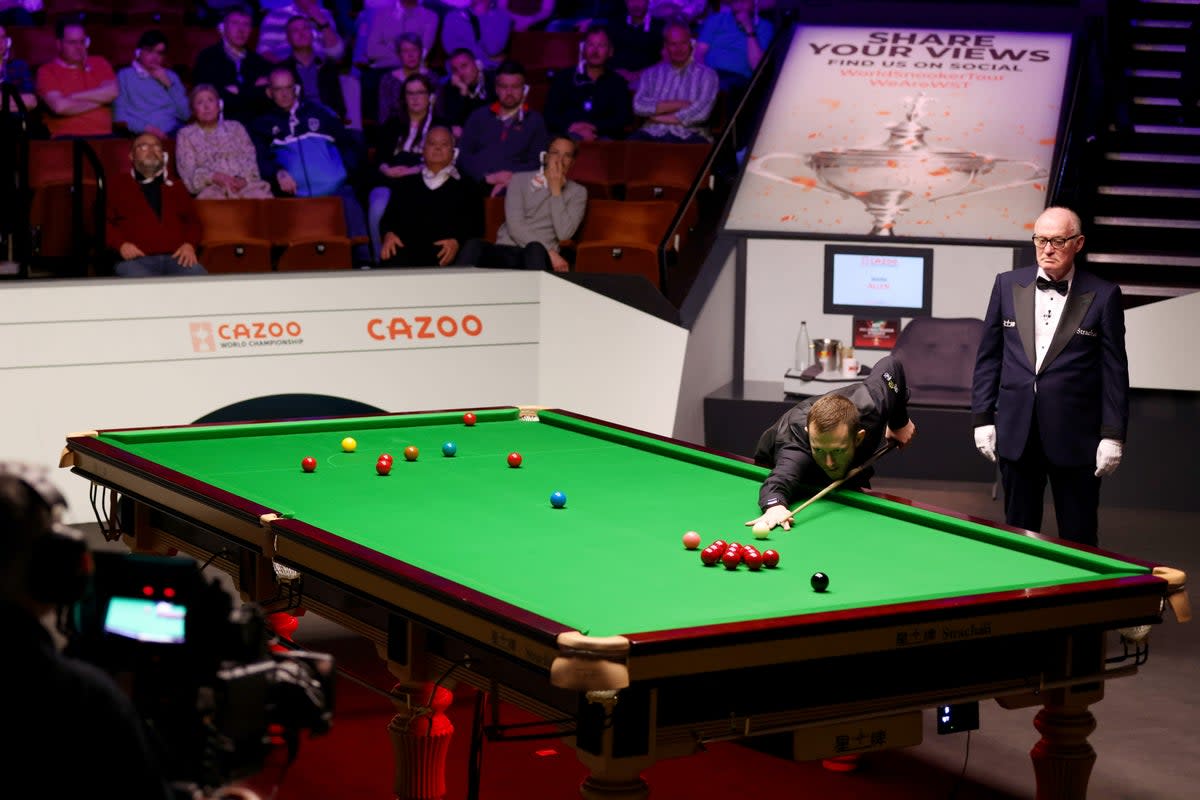 Mark Allen goes for a pot in the championship last year during a match against Mark Selby (Getty)