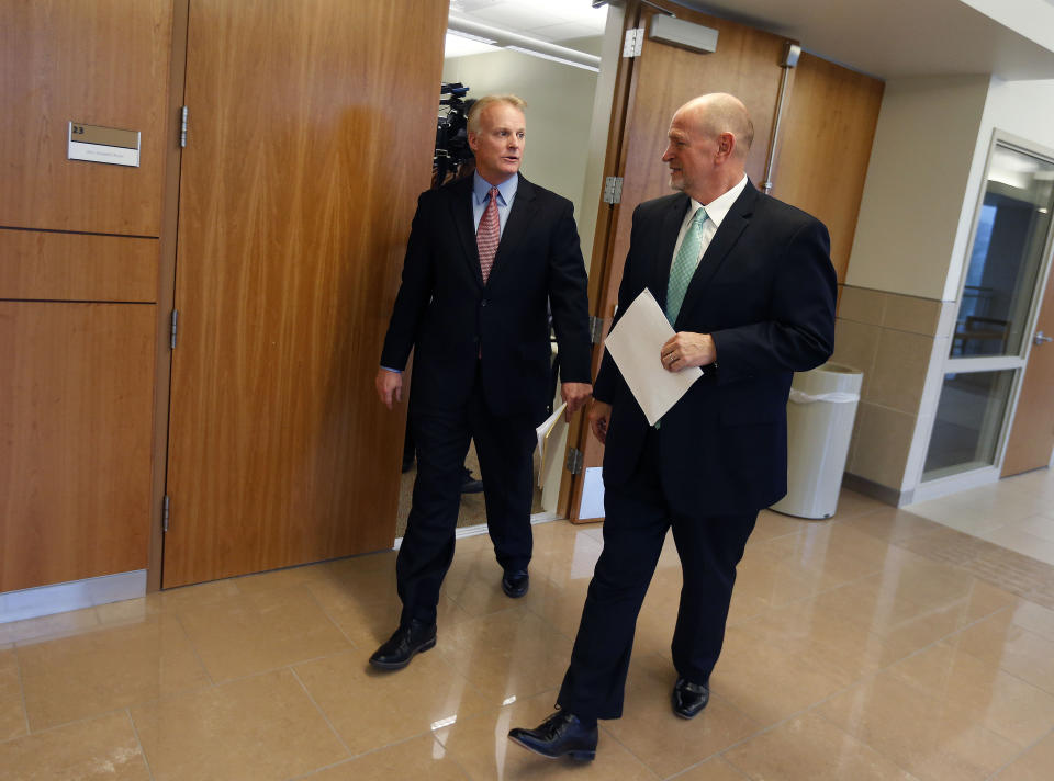 Tooele County Attorney Scott Broadhead and chief deputy attorney Gary Searle leave a press conference where they announced criminal charges against Colin Jeffery "CJ" Haynie, 16, during a press conference at the Tooele County Courthouse on Wednesday, Jan. 22, 2020. Haynie faces four counts of aggravated murder, attempted aggravated murder in the shooting deaths of his mother and three siblings. (Laura Seitz/The Deseret News via AP)