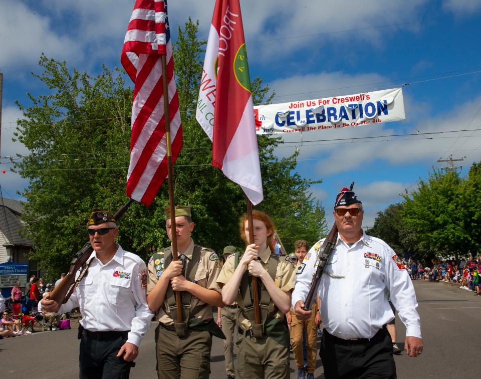 With a VFW escort, Boy Scouts carry the flags at the 2022 Creswell 4th of July Celebration Parade.