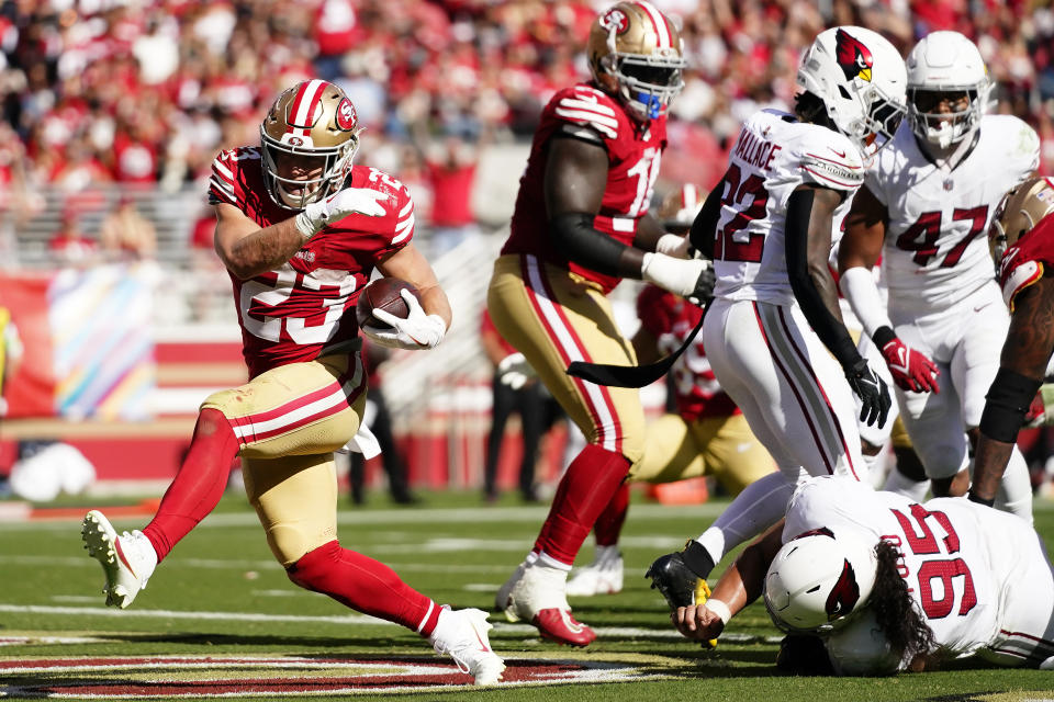 San Francisco 49ers running back Christian McCaffrey (23) scores a touchdown during the second half of an NFL football game against the Arizona Cardinals in Santa Clara, Calif., Sunday, Oct. 1, 2023. (AP Photo/Godofredo A. Vásquez)