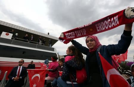 Turkish President Tayyip Erdogan addresses his supporters upon his arrival at Esenboga Airport in Ankara, Turkey April 17, 2017. REUTERS/Stringer