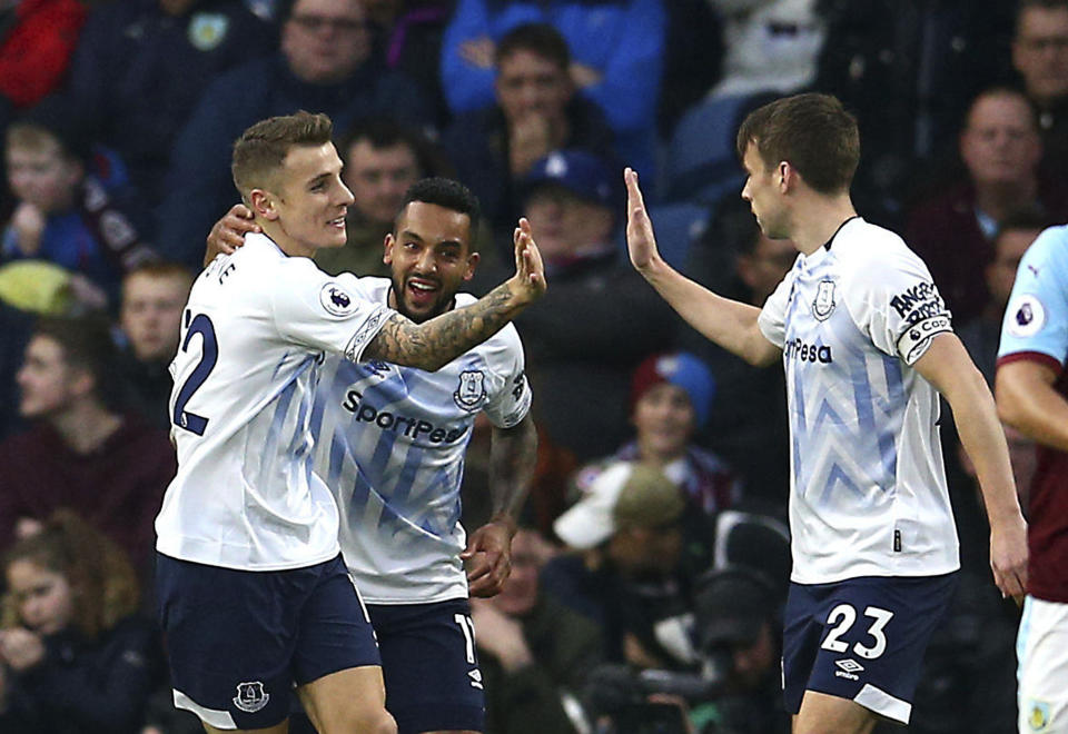 Everton's Lucas Digne, left, celebrates scoring his side's second goal of the game with team mates during the English Premier League soccer match between Burnley and Everton at Turf Moor, in Burnley, England, Wednesday, Dec. 26, 2018. (Dave Thompson/ PA via AP)