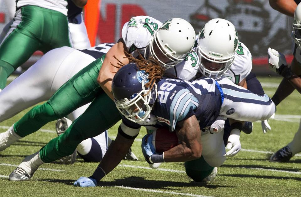 Sam Hurl (39, L) is bringing his hard-tackling style to Winnipeg. (Fred Thornhill/The Canadian Press.)