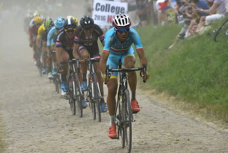 Astana rider Vincenzo Nibali of Italy cycles on a cobble-stoned section during the 223.5-km (138.9 miles) 4th stage of the 102nd Tour de France cycling race from Seraing in Belgium to Cambrai, France, July 7, 2015. REUTERS/Bernard Papon/Pool