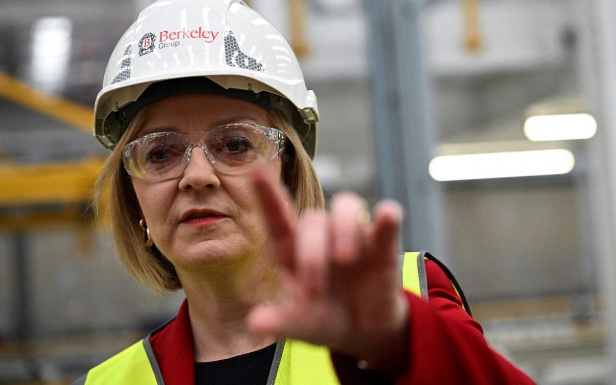 Liz Truss on a factory visit in Kent after announcing her tax and economic reforms this week - AFP