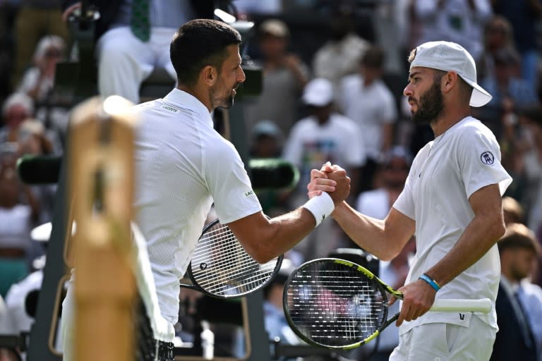 Novak Djokovic shakes hands with Jacob Fearnley at the end of their second-round match at Wimbledon (Ben Stansall)