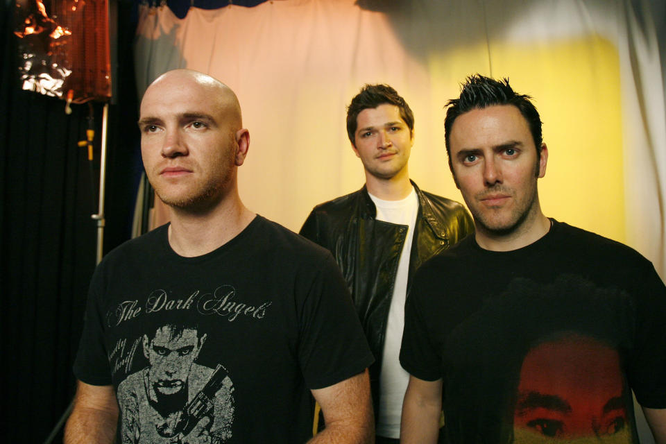 FILE - Band members from The Script, Mark Sheehan, left, Danny O'Donoghue, center, and Glen Power pose for a portrait, Friday, May 29, 2009 in New York. Ireland’s president has led tributes to Mark Sheehan, guitarist with Irish rock band The Script, after his death at the age of 46. The band said Sheehan died in a hospital on Friday, April 14, 2023, after a brief illness. In a statement, The Script called him a “much loved husband, father, brother, band mate and friend.” (AP Photo/Jeff Christensen, File)