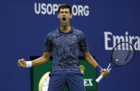 FILE - In this Sept. 9, 2018, file photo, Novak Djokovic, of Serbia, reacts after breaking the serve of Juan Martin del Potro, of Argentina, during the men's final of the U.S. Open tennis tournament, in New York. Djokovic announced Thursday, Aug. 13, 2020, he will enter the Grand Slam tournament and the hard-court tuneup preceding it in New York.(AP Photo/Adam Hunger, File)