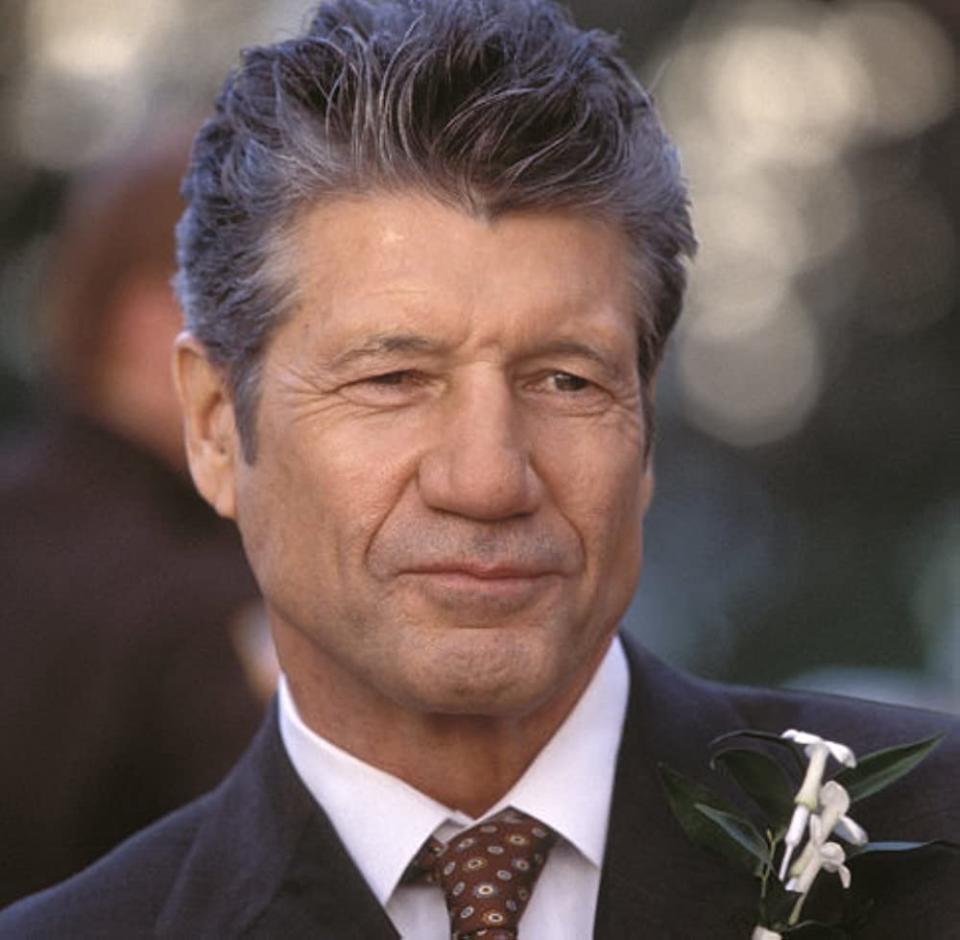 Fred Ward wearing a suit