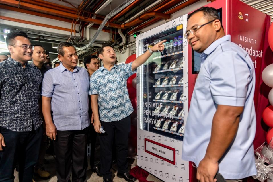 Economy Minister Rafizi Ramli launches the Inisiatif Pendapatan Rakyat (IPR) vending machine at the Cempaka LRT station in Ampang February 26, 2023. ― Picture by Firdaus Latif