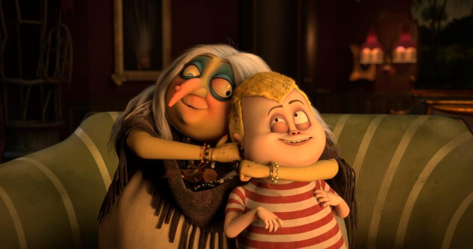 Pugsley (voiced by Finn Wolfhard, right) hangs with Grandma (Bette Midler) in 