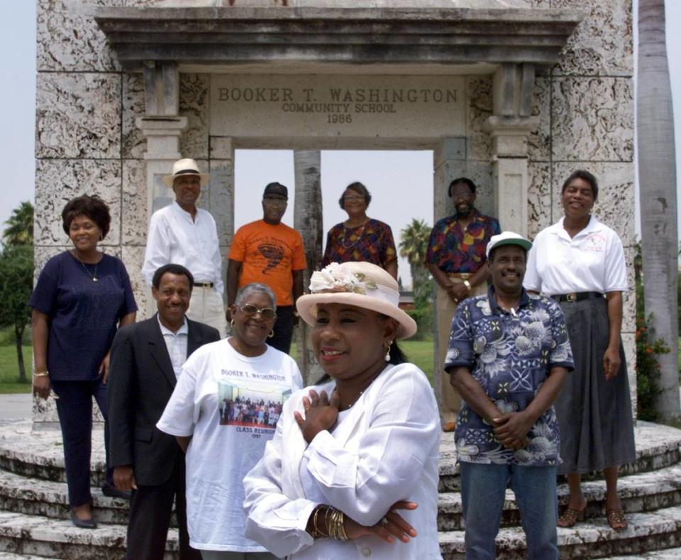 Graduates of Booker T. Washington High School. gather in front of the Miami school on Aug. 3, 1999. There’s Maud Newbold Class of ’58, Millicent Henderson ’57, Charles F. Johnson ’60, Carolyn K. Dunnell ’59, Robert L. McKinney ’60, Alphonso Brown ’56, Juanita Humes ’51, Eugene Strachan ’55, Elaine Symonette ’57, and Jimmy Johnson ’60.