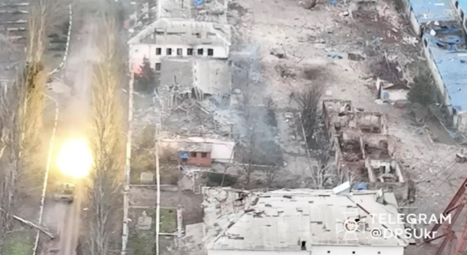 A tank fires a round, amid Russia's attack on Ukraine, in Soledar, Donetsk region, Ukraine, in this screen grab released on January 8, 2023 and obtained from a social media video by Reuters on January 10, 2023. State Border Guard Service Of Ukraine/via REUTERS  THIS IMAGE HAS BEEN SUPPLIED BY A THIRD PARTY. MANDATORY CREDIT.