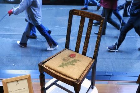 The chair used by British author J.K. Rowling while writing "Harry Potter and the Sorcerer's Stone" and "Harry Potter and the Chamber of Secrets" is shown in the window of Heritage Auctions in New York April 4, 2016. REUTERS/Lucas Jackson -