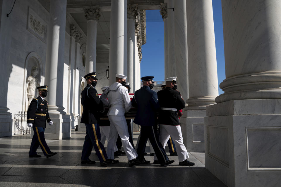 The flag-draped casket of the late Rep. John Lewis, D-Ga., is carried by a joint services military honor guard from Capitol Hill, Wednesday, July 29, 2020, in Washington. (Anna Moneymaker/The New York Times via AP, Pool)
