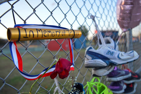 A memorial is seen on the campus of Lafayette High School for Trinity Gay, the daughter of Olympic sprinter Tyson Gay, who died in an exchange of gunfire early Sunday morning, in Lexington, Kentucky, October 17, 2016. REUTERS/Bryan Woolston