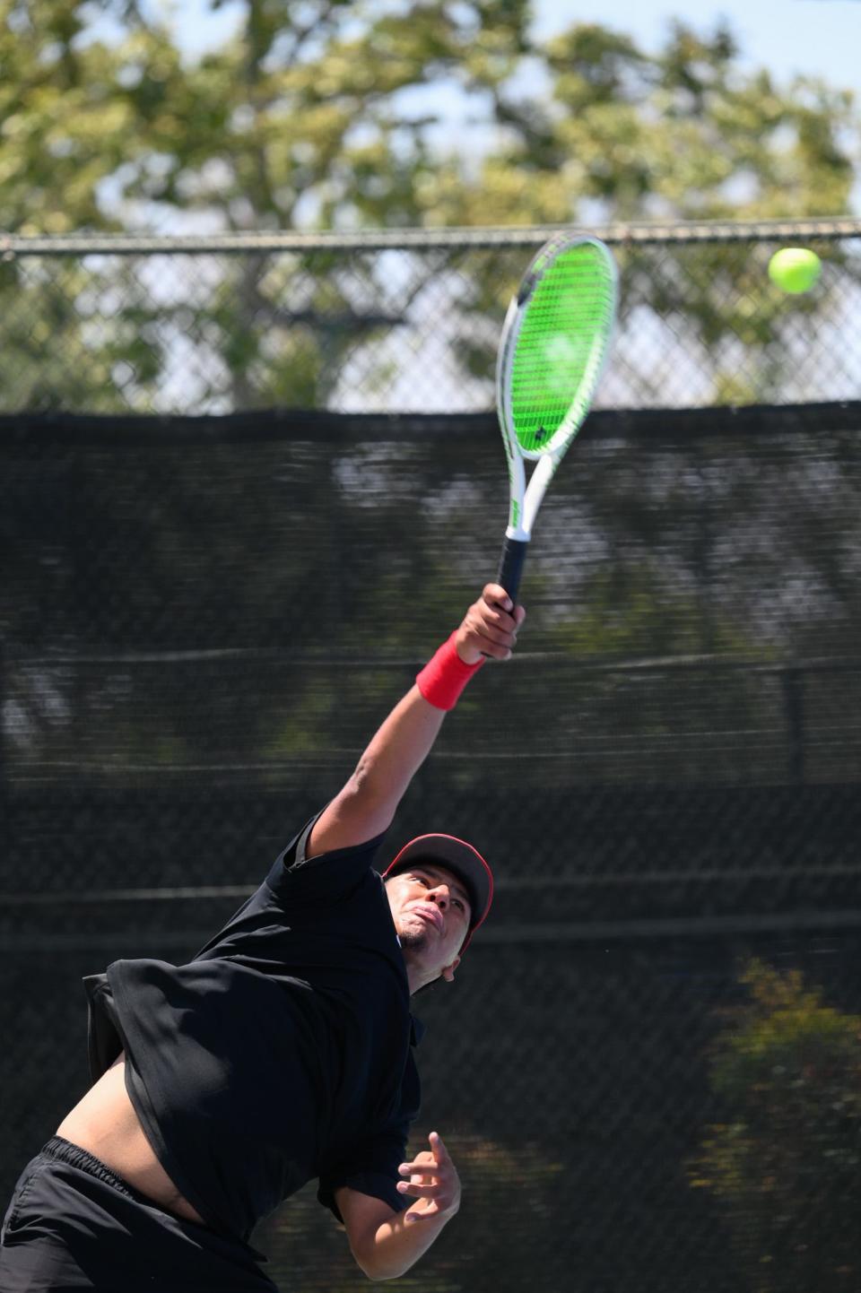 Oak Hills Isaac Tovar serves the ball during a match against New Road’s Cy Arato-Orlovski during the boys tennis Division 6 CIF-Southern Section Finals at The Claremont Club on Friday, May 10, 2024 in Claremont, California. New Roads defeated Oak Hills 11-7.