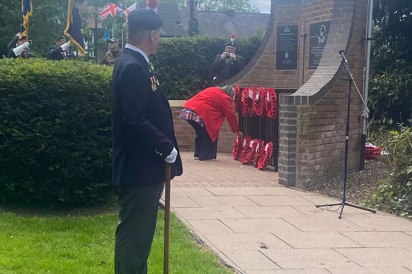 Denise Carter lays a wreath for her son at the Royal Warwickshire Memorial during the special D Day 80 anniversary service, which was held after the road renaming