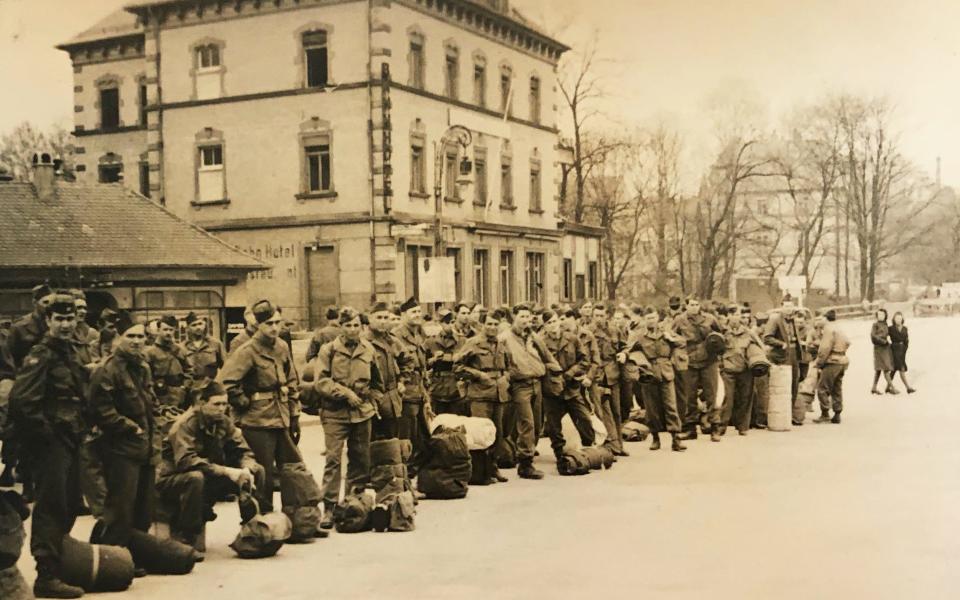 Larry Simon photographed fellow G.I.s as he and they prepared to board a train to leave Germany in April 1946. They sailed from a port in France bound for New York City.