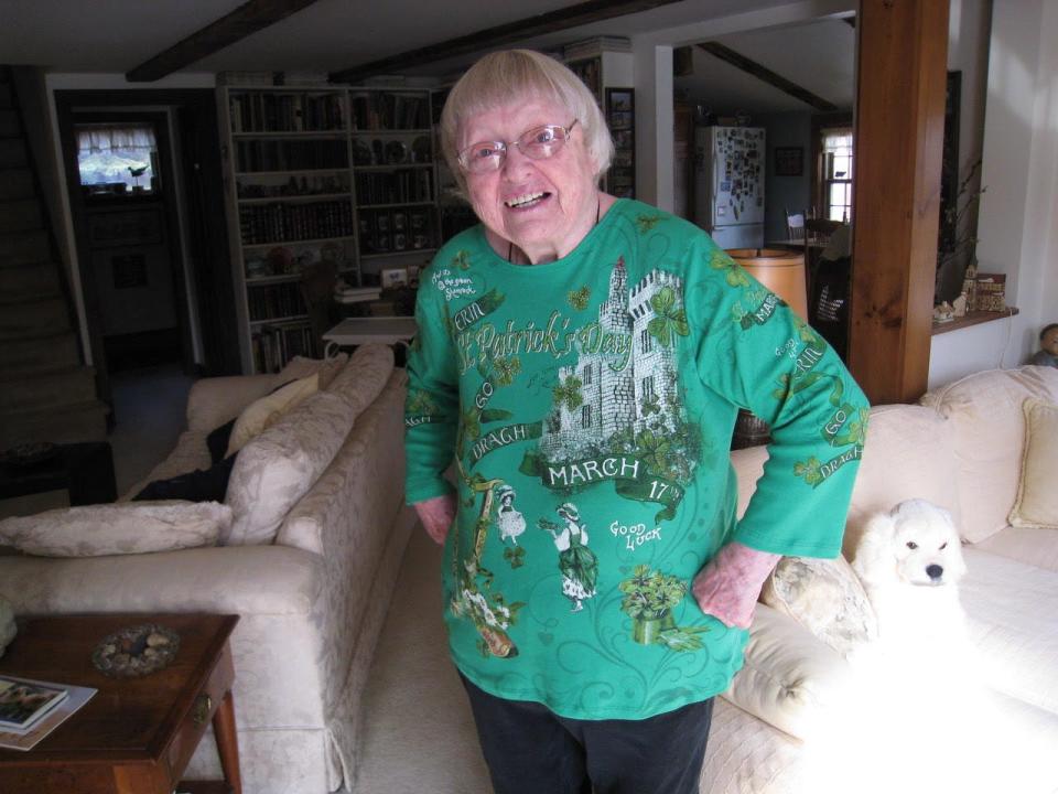 Award-winning actress Pat Carroll shows off a sweater that celebrates her Irish roots at her Harwich Port home in 2017.