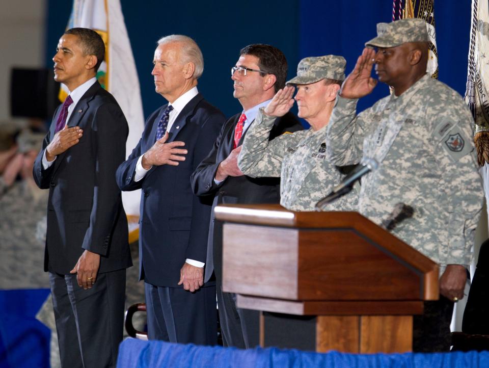 President Barack Obama, from left, Vice President Joe Biden, Deputy Secretary of Defense Ashton Carter, and Chairman of the Joint Chiefs of Staff Martin Dempsey stand for the National Anthem during a ceremony marking the return of Gen. Lloyd Austin, right, at Andrews Air Force Base, Md., on Dec. 20, 2011. The return of Austin, the top U.S. commander in Iraq, his staff, and the U.S. Forces-Iraq command flag, marked the formal end to the U.S. military mission in Iraq.