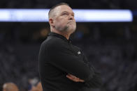 Denver Nuggets coach Michael Malone watches during the first half of Game 6 of the team's NBA basketball second-round playoff series, against the Minnesota Timberwolves, Thursday, May 16, 2024, in Minneapolis. (AP Photo/Abbie Parr)