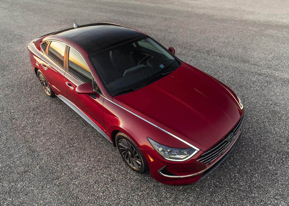 A view from the top of a red Hyundai 2022 Sonata Hybrid, showcasing its solar power roof.