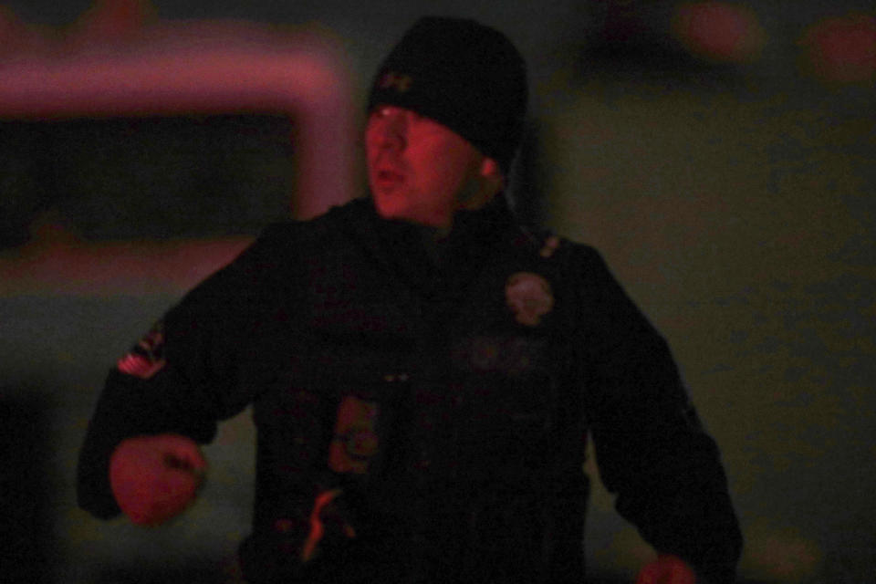 A law enforcement officer stands stands near the Enoch, Utah, home where eight family members were found dead from gunshot wounds, Wednesday, Jan. 4, 2023. (Ben B. Braun/The Deseret News via AP)