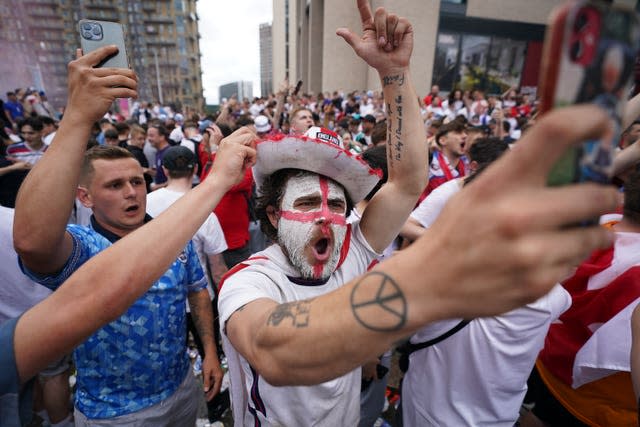 Fans have painted their faces in the nation's colours to show their support (Zac Goodwin/PA)