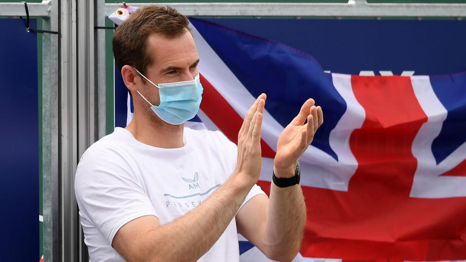 Seen here, British tennis star Andy Murray applauds at the side of the court.