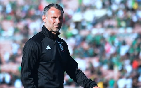 Wales coach and former Manchester United star Ryan Giggs looks on prior to kickoff against Mexico in their international soccer friendly at the Rose Bowl - Credit: AFP