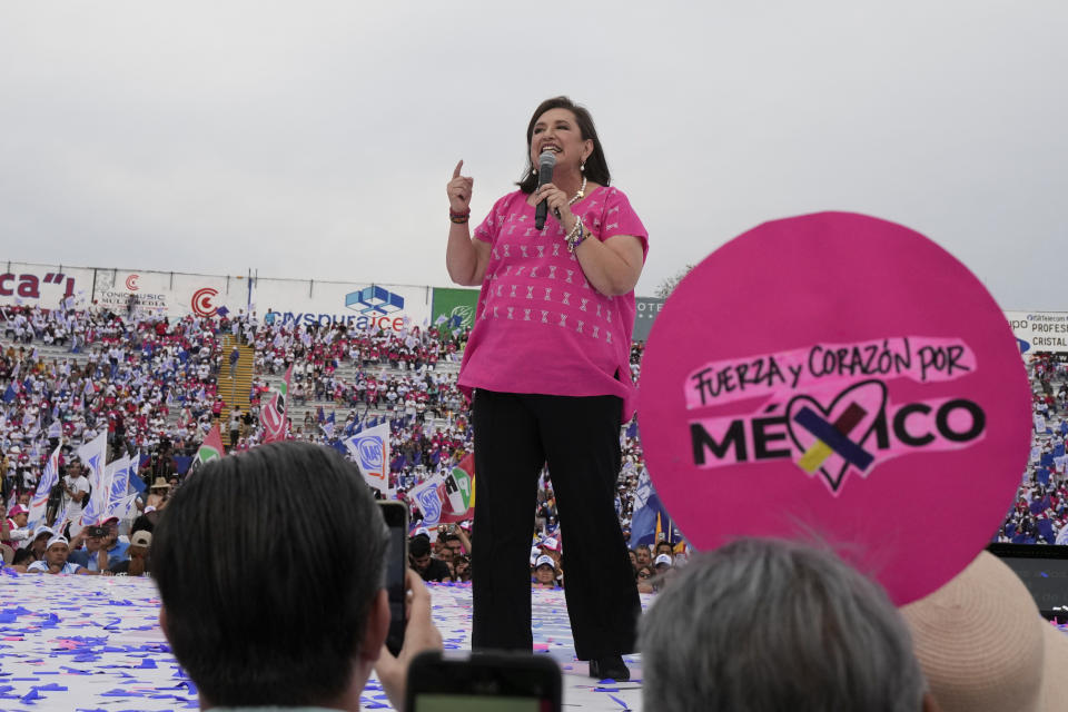 FILE - Presidential candidate Xóchitl Galvez waves during her opening campaign rally in Irapuato, Mexico, Friday, March 1, 2024. General Elections are set for June 2. Mexico’s presidential candidates on Monday, March 11, 2024, signed a commitment for peace with Catholic Church leaders that proposes strategies to reduce the violence in the country.(AP Photo/Fernando Llano, File)